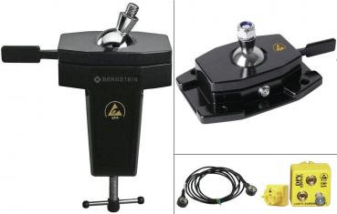 In the picture, various ESD protection devices are visible: a black grounding clip with screw attachment, a cable, and a yellow grounding device with connectors.