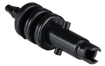 It is a black, elongated object with several round, profiled elevations in the middle. At one end, there is an opening that looks like a connector.