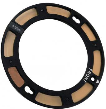 The image shows a round filter frame made of black plastic. It has several transparent areas and is labeled with "4350K" and "FRONT". The frame has two small holes for attachments.