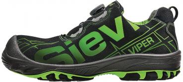 The shoe is lightweight and sporty, predominantly black with green accents. It has a non-slip sole, laces, and a reinforced toe cap for extra protection.