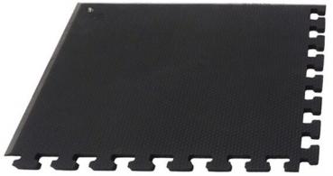The image displays a square, black carpet tile piece with serrated edges. The surface is textured and slip-resistant, ideal for various floorings.