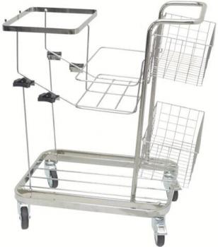 The image shows a silver serving cart with four wheels. It has multiple shelves in the form of a wire basket and a flat surface on top. The frame is made of metal.