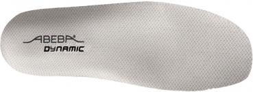 The image displays a bright shoe sole with a textured surface. In the center, the inscription "ABEBA DYNAMIC" is visible in black. The sole has a standard ergonomic shape.
