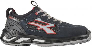 The shoe is a sporty, dark blue half-shoe with gray and red accents. It has a padded sole, laces, and breathable material. The sides feature a special gray logo.