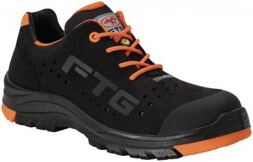 Black work shoes with orange accents. They feature lacing, ventilation holes, and a sturdy, non-slip sole. Ideal for safety and comfort at work.