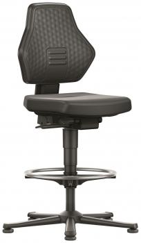 The chair is black, has an ergonomic shape with a padded seat and a high back. It stands on a rolling base ring, which is height adjustable.