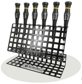 The image shows a black, grid-like holder with six screwdrivers. The screwdrivers have grippy, black handles with yellow accent lines, standing upright in the holder.