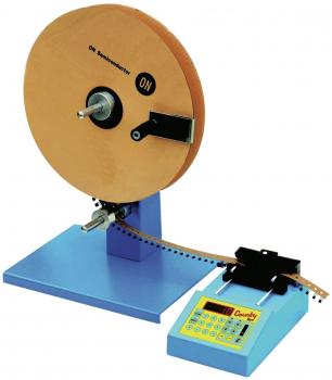 The image shows a physical experiment apparatus. It has a large, round wooden wheel on a stable blue base, with a digital display and buttons for control.