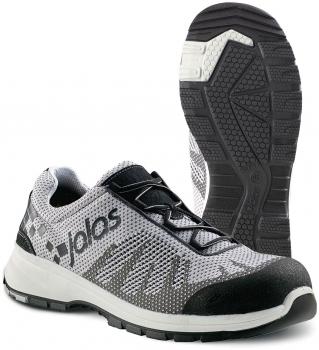 The image shows a gray sports or running shoe with black and white accents. The sole has a textured pattern for better grip. Laces are visible.