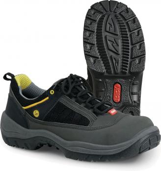 The image shows a pair of black sports shoes with yellow and gray accents. The sole is grippy and heavily treaded, ideal for outdoor activities. The shoe has a laced front.