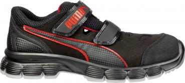 The shoe is sporty and black, with red accents. It features a breathable upper, a cushioned sole, and a Velcro fastener for easy on and off.