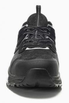The image shows a black sports shoe from the front. It has a textured fabric upper, strong laces, and a sturdy sole. The shape is sporty and modern.