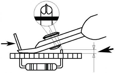 The image shows a technical drawing with a hand holding a tool that presses on a schematic representation of a circuit board. Above is an enlarged view of a component.