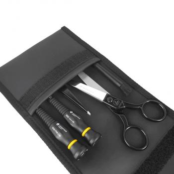 The image shows a black tool case that is open. Inside are two screwdrivers with yellow handles, a sharp pair of scissors, and another tool.