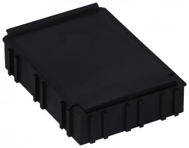 It is a black, rectangular box with slightly rounded edges. The surface is smooth, and the sides are structured with grooves. It appears sturdy and functional.