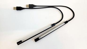 The image shows a USB light, consisting of two narrow, transparent tubes with black ends. A USB connector leads to a cable that connects the tubes.