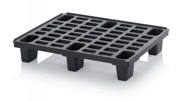 The image shows a black plastic pallet with a flat, rectangular design. It has many square and rectangular indentations for stability and easy handling.