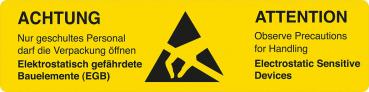The image shows a yellow warning sign with black text. On the left side it reads 