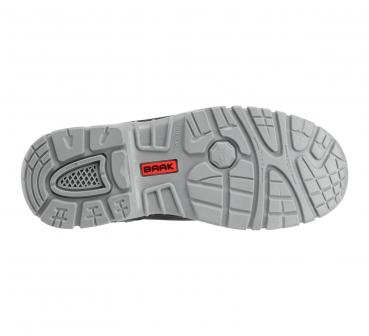 The image shows the sole of a sports shoe. It is light gray with a non-slip tread that consists of various patterns. In the center, the word "BRAK" is visible in red lettering.