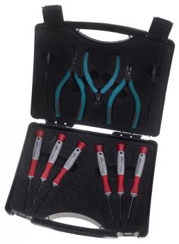 The image shows a toolbox. It contains two pliers with blue handles and several screwdrivers with red handles. The case is black and has a textured surface.