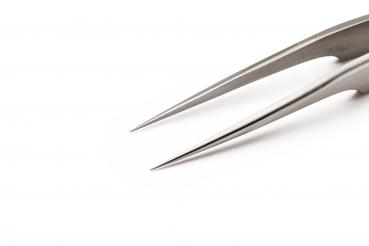 The image shows the tip of a long, slender pair of metal pliers with two sharp, pointed ends. The background is plain and white, which makes the pliers stand out prominently.