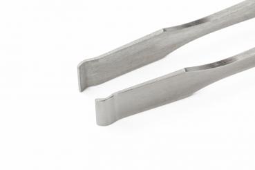 The image shows a metallic tweezer with a narrow, flat shape. The ends are slightly curved and have a wide opening, ideal for grasping small objects.