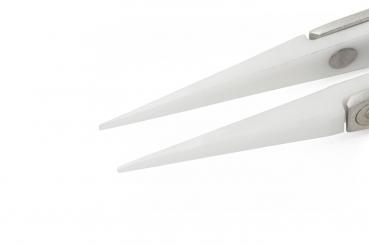 The image shows the tips of a pair of scissors. They are narrow and sharp, made from shiny metal, with a silver hinge in the center. The background is solid white.