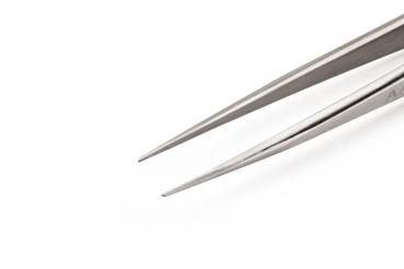 The image shows a narrow, metallic tweezer with pointed ends. The background is uniformly white, highlighting the tweezer clearly. It is long and precise.
