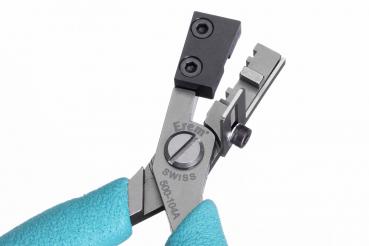 The image shows a small pair of pliers with a metallic surface. The handle is covered with blue rubber coating. At the tip of the pliers, there are two black attachments for precise handling.