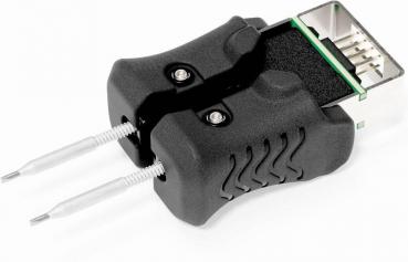 The image shows a device that looks like a black handle with two metal pins. It has a plug at the top end and is intended for testing or programming electronic components.