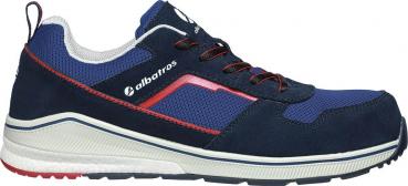 The shoe is sporty and colored in blue and gray. It has a fabric-covered upper, red accent lines, and a light gray, non-slip sole. Laces keep it secure.