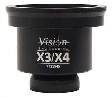 The image shows a black, cylindrical object with a wider top and a narrower bottom. It has a label marked 