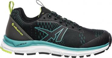The shoe is a black sneaker with a textured surface, reinforced toe area, and a flexible rubber sole. It has black laces and a sporty shape.
