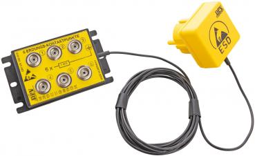 The image shows a yellow module unit with several connection sockets and a long cable. At one end of the cable, there is another yellow plug marked "ESD".