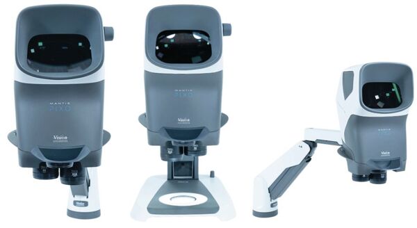 The image shows a device with a large, square viewing window on the top. Below it are two round lenses. The colors are primarily gray with some blue and white details.