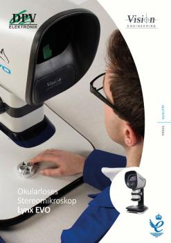 The image shows a man working on a modern, ocular-free stereo microscope. The microscope has a large, round monitor and is situated on a table.