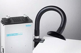 The image shows a white device with two tubes on top, used for air purification. It has a straight rectangular shape and the inscription 