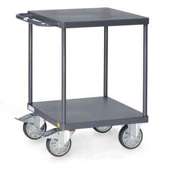 The cart has a square, sturdy table with two shelves. It is made of gray metal and stands on four large, swivel wheels. A side handlebar makes it easier to push.