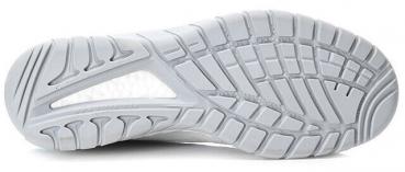 The image displays the sole of a white sports shoe. The sole features a textured pattern with grooves and studs that provide grip and traction.