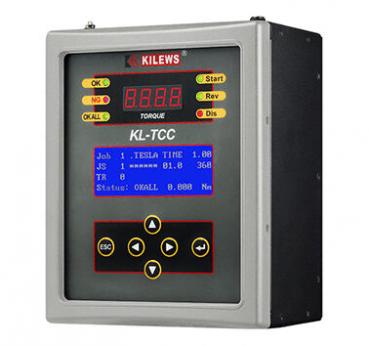 The image shows a digital measuring device with a large, illuminated display. There are buttons for start, rewind, menu, and a directional key in the middle. The display shows values for torque and status.