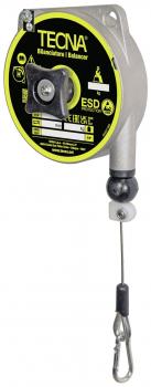 The image shows an electric reeling device with a round, black casing and yellow lettering. A cable with a hook hangs down from it to secure objects.