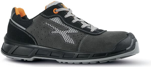 The shoe is a sporty, mid-length sneaker in black with green laces. It features a cushioned sole and a modern design with side ventilation holes.