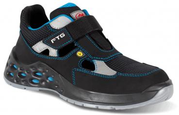 The shoe is black with blue and gray details. It has a wide Velcro strap, breathable inserts, and a textured sole with small holes for good grip.