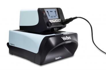 The image shows an electronic device in black and light blue with a display, buttons, and an attached cable. It appears to be a soldering station or a similar tool.