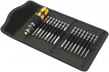 The image displays a toolset in a black storage bag. At the center is a screwdriver with a yellow handle. Adjacent to it are several bits in various lengths.
