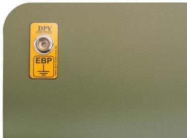 The image shows a green, padded surface with rounded corners. On the surface, there is a yellow label with the inscription "DPV" and "EBP" along with a silver turning knob.