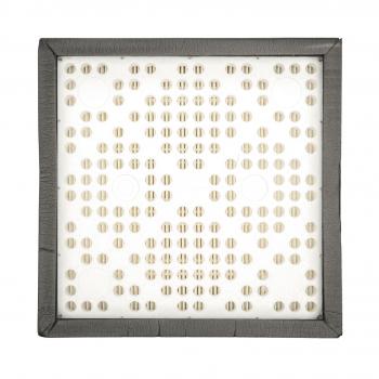 The image displays a square area with many small, round openings in a uniform pattern. The frame is dark and accentuates the white surface.