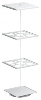The image depicts a modern, freestanding shelf with three square, white shelves connected by a slender rod. The shelves are designed in a minimalist style.