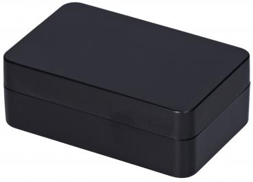 Das Bild zeigt eine rechteckige, mattschwarze Box mit abgerundeten Kanten. Sie hat einen glatten, einheitlichen Oberflächenfinish und wirkt schlicht und modern.