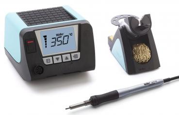 The image shows a soldering station. It consists of a black casing with blue accents, a digital display, a soldering tip, and a container for cleaning the tip.
